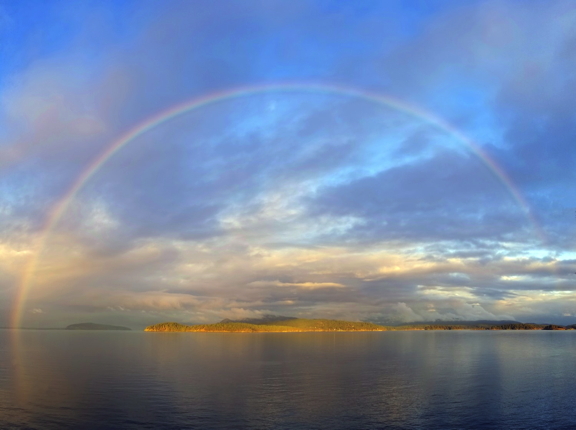 A full rainbow, photographed by Alex from her studio deck.